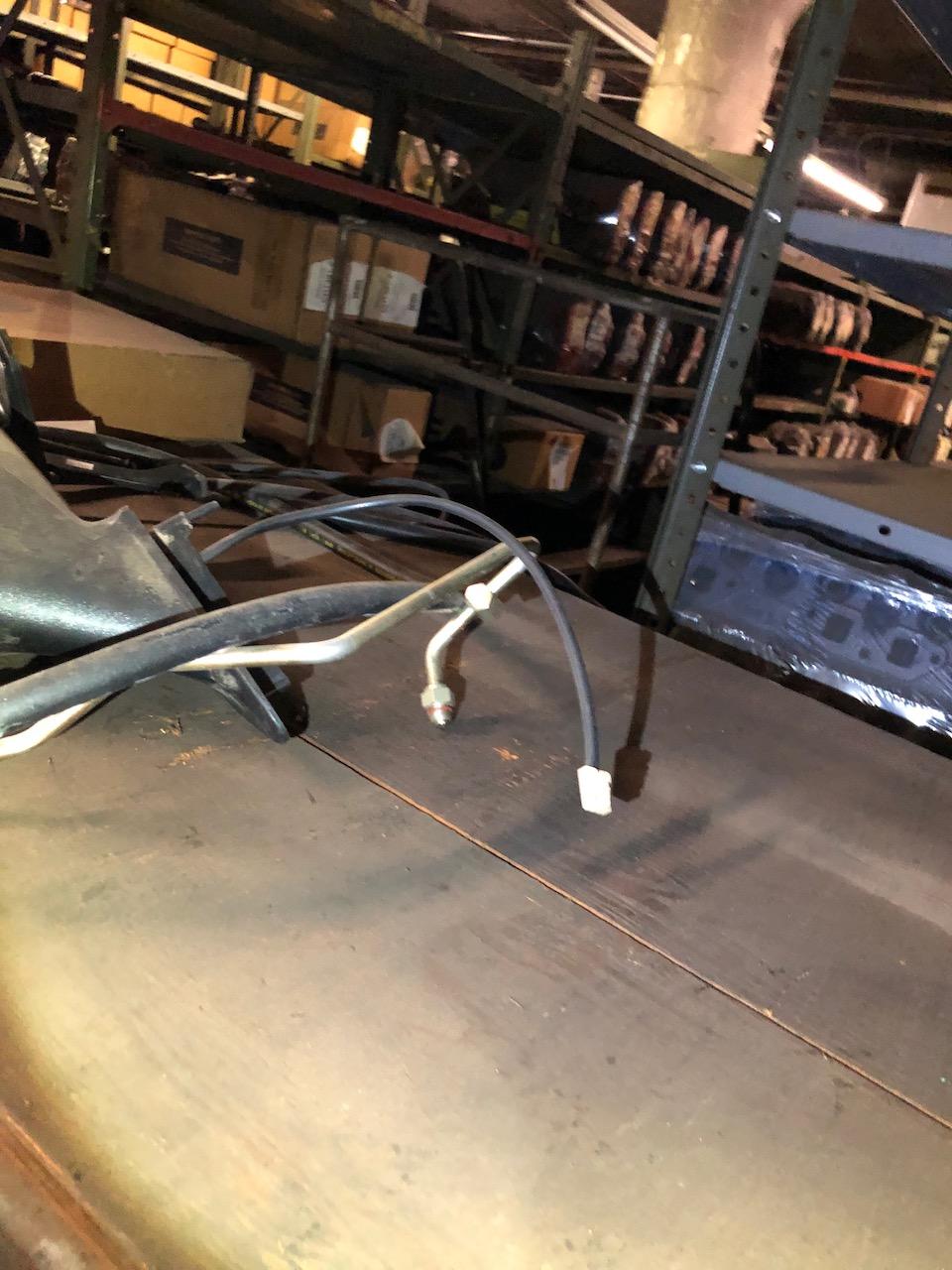 Parts on shelf, box peg hooks. No shelving