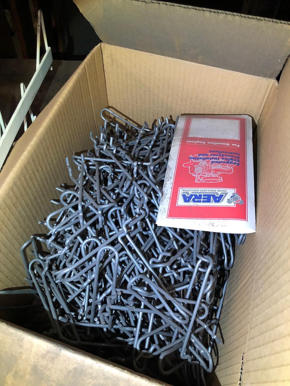 Parts on shelf, box peg hooks. No shelving