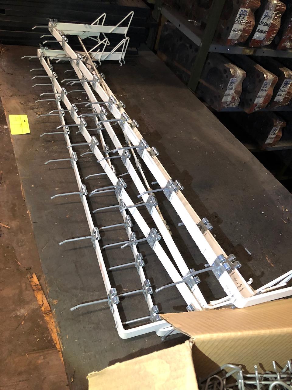 Parts on shelf, box peg hooks. No shelving