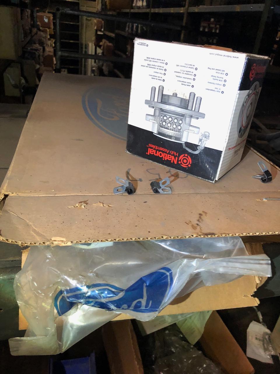 Parts on shelf, box peg hooks. No shelving