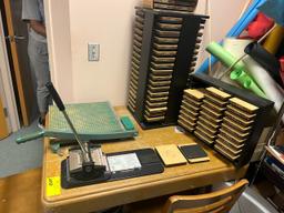 Loc: 5. Original Ellison lettermachine (to include letter blocks, table, chair and paper cutter). Th