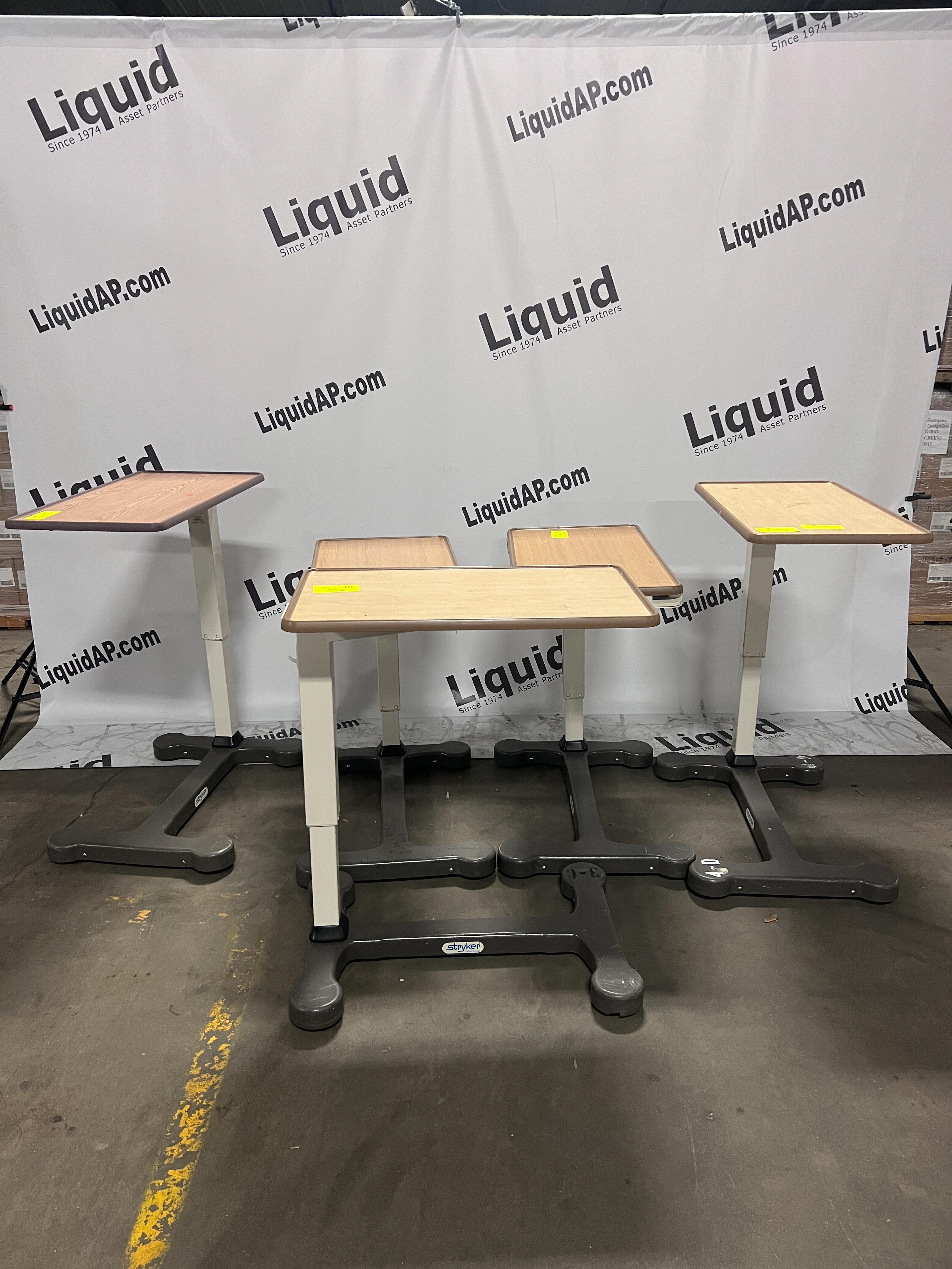 Stryker adjustable overbed tables