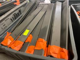LargeTote of Used Conveyor Sliders Approx 46.5" Long X 4.5" Wide - Approx QTY 60