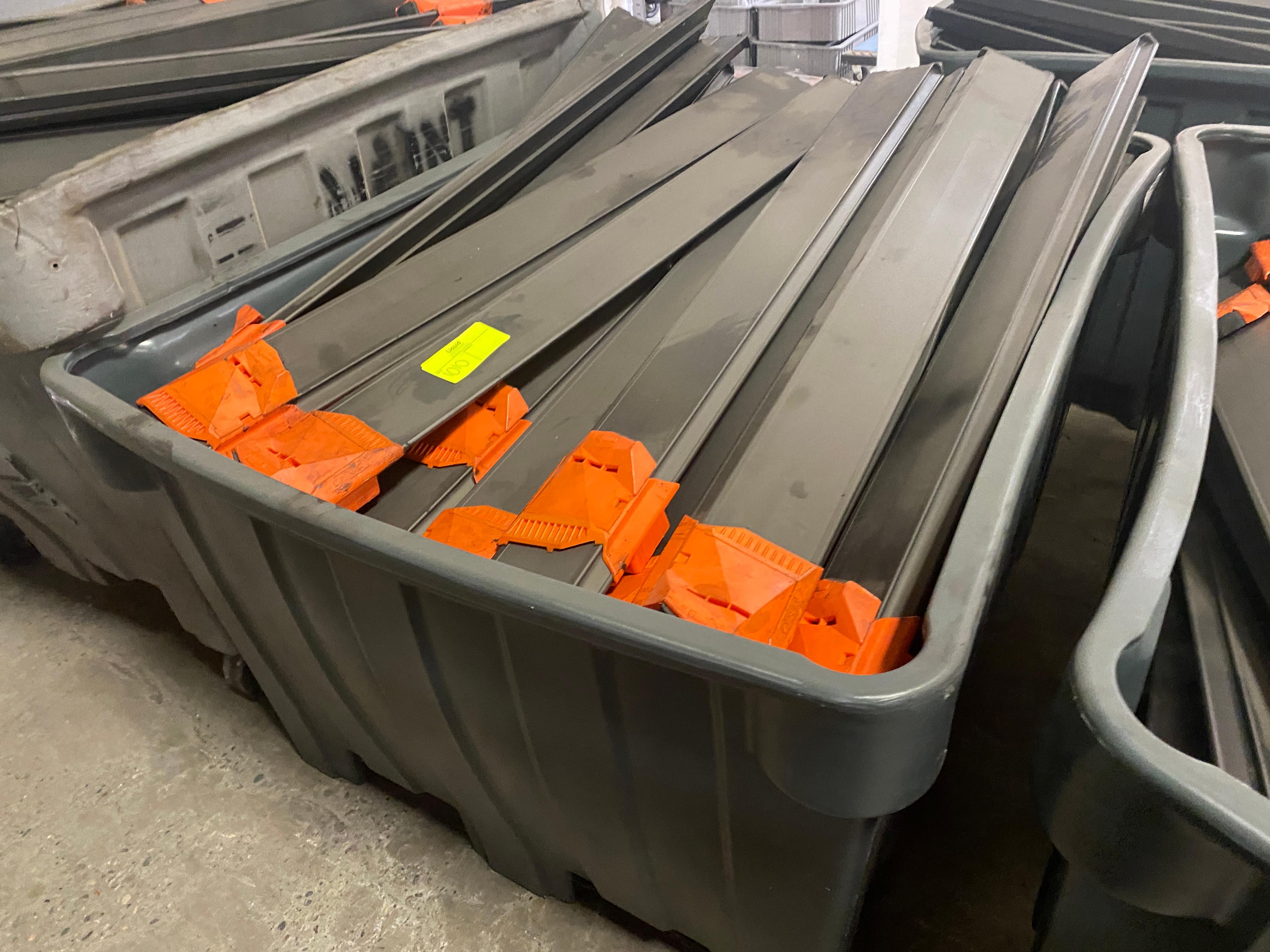 LargeTote of Used Conveyor Sliders Approx 46.5" Long X 4.5" Wide - Approx QTY 60