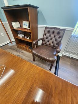 Executive office furniture with desk, chairs, and Lenovo dual monitors and keyboard