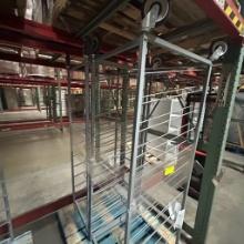 Slanted metal shelf on casters