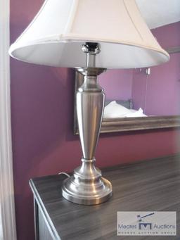 Silver-colored lamp with shade