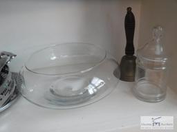 Shelf of glassware, serving items and basket