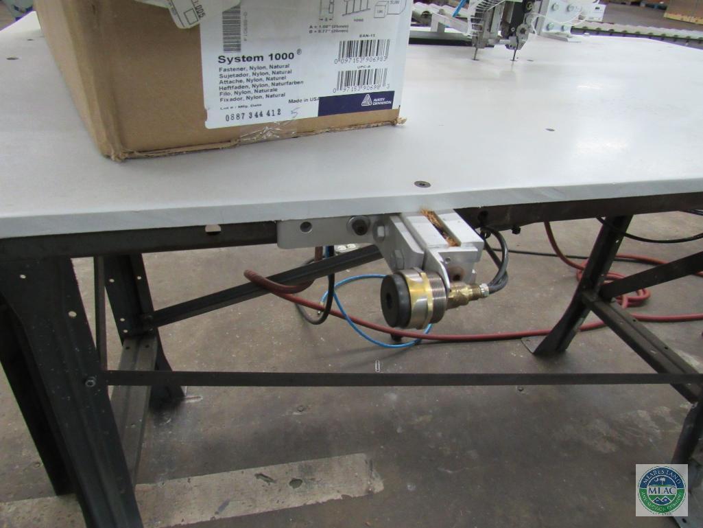 Tagger unit - with dual stitch capability and short roller conveyor section
