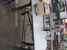 Tagger unit - with dual stitch capability and short roller conveyor section