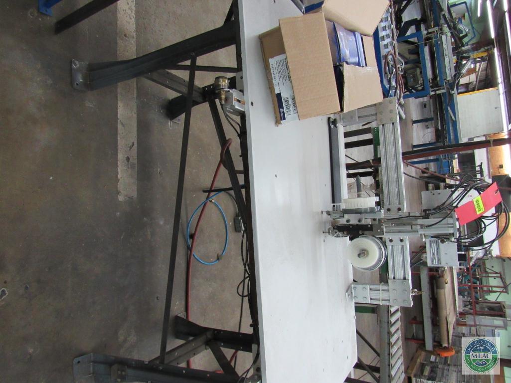 Tagger unit - with dual stitch capability and short roller conveyor section