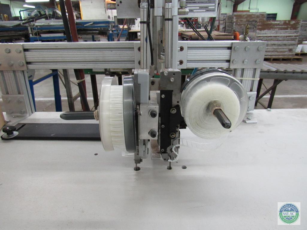 Tagger unit - with dual stitch capability and short roller conveyor section