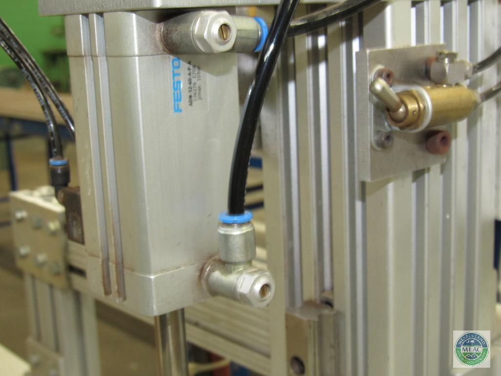 Tagger unit - with dual stitch capability and short roller conveyor section