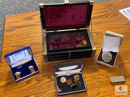 Assortment of Cuff Links, Money Clip, and Belt Buckle