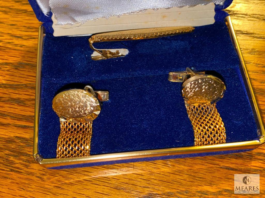 Assortment of Cuff Links, Money Clip, and Belt Buckle