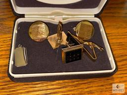 Assortment of Cuff Links, Money Clip, and Belt Buckle