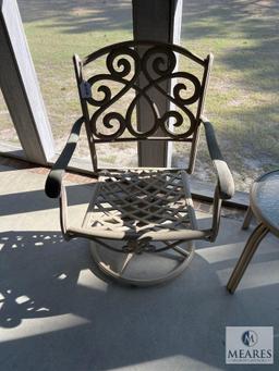 Two Metal Outdoor Swivel Chairs and Small Table