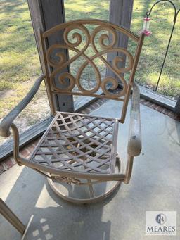 Two Metal Outdoor Swivel Chairs and Small Table