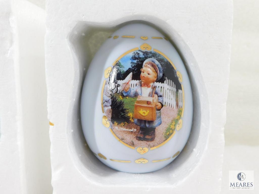 Lot of Three Hummel Collectible Porcelain Eggs: Apple Tree Girl, Postman, Merry Wanderer