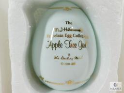 Lot of Three Hummel Collectible Porcelain Eggs: Apple Tree Girl, Postman, Merry Wanderer