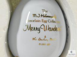 Lot of Three Hummel Collectible Porcelain Eggs: Apple Tree Girl, Postman, Merry Wanderer
