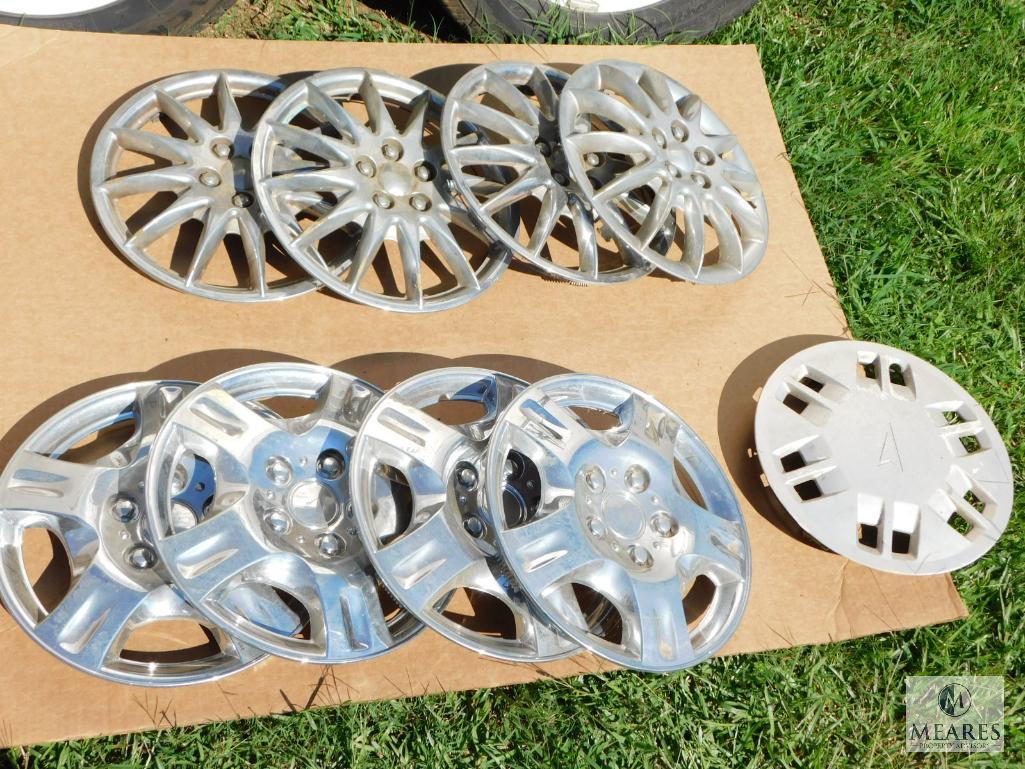 Two Sets of Four Hubcaps Plus One Extra