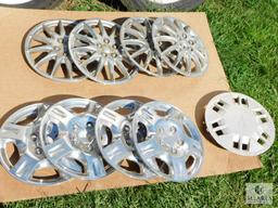 Two Sets of Four Hubcaps Plus One Extra