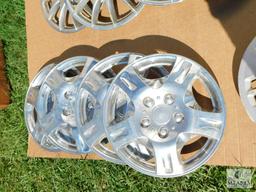 Two Sets of Four Hubcaps Plus One Extra