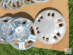 Two Sets of Four Hubcaps Plus One Extra