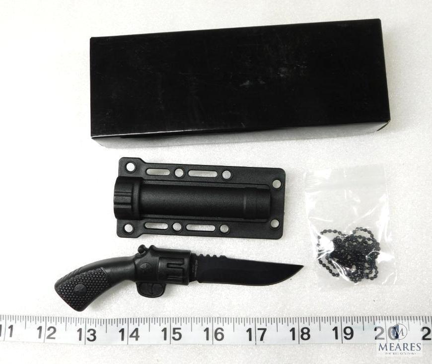 Fixed Blade Knife That Looks Like a Pistol With a Plastic Sheath and Neck Chain