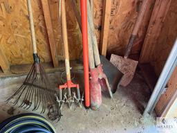 Group of Lawn Tools and Water Hose