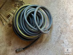 Group of Lawn Tools and Water Hose