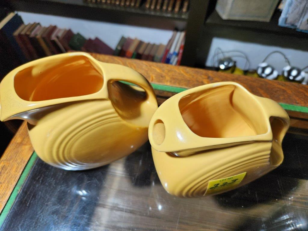 2 Yellow Fiesta ware Pitchers