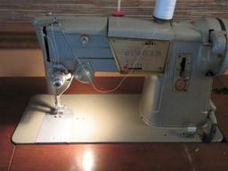 Vintage Green Singer Sewing Machine in Cabinet, Powers on Needle/Feed Move Cabinet