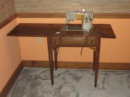 Vintage Green Singer Sewing Machine in Cabinet, Powers on Needle/Feed Move Cabinet