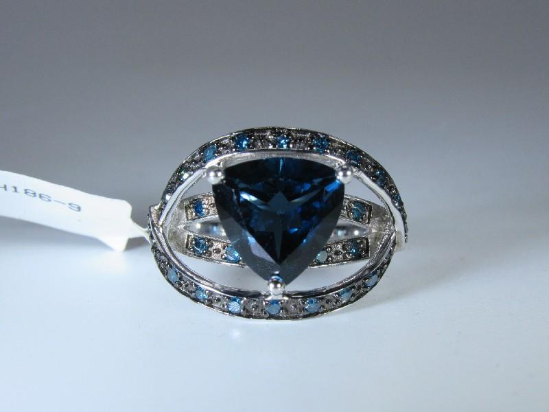 Sterling Silver Ring w/ Dark Blue Topaz Center w/ 23 Smaller Stones