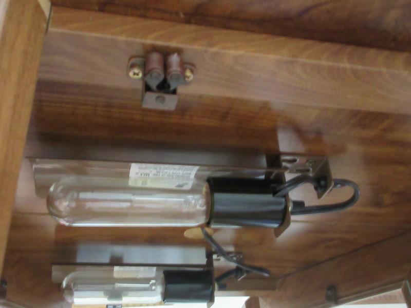 Orleans Curio Cabinet Simulated Wood Grain Finish Features Illuminated Interior