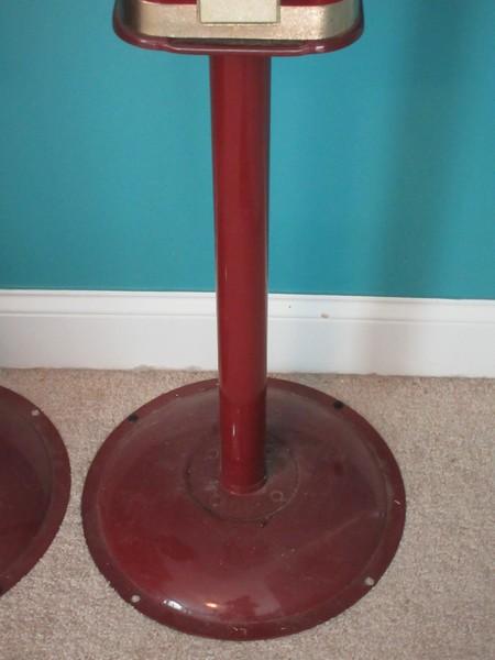 2 Gumball Machine Plastic Globe Sitting on Red Metal Base Stands Operated Mechanically Coin