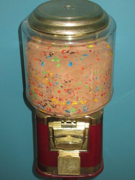 2 Gumball Machine Plastic Globe Sitting on Red Metal Base Stands Operated Mechanically Coin