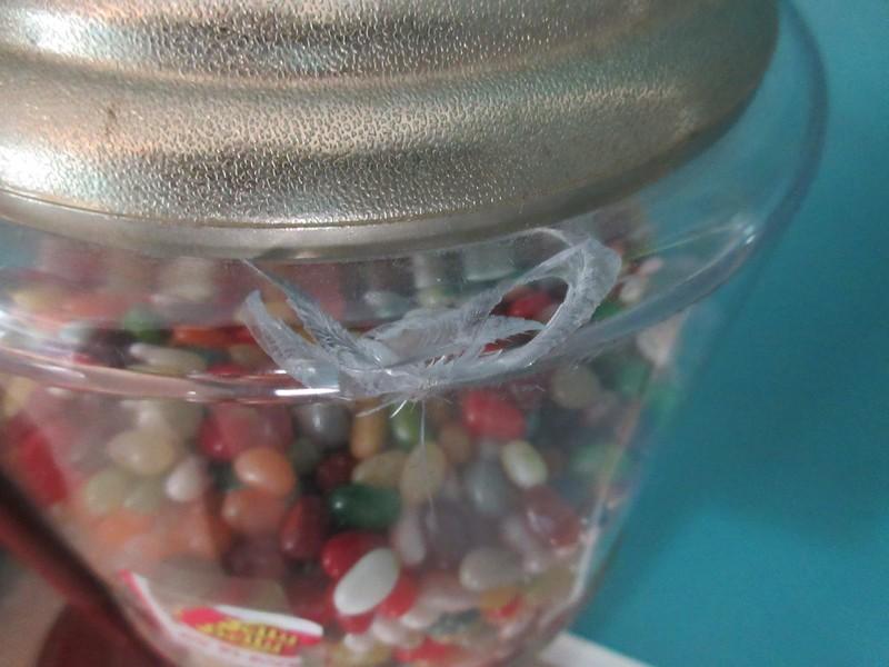 2 Gumball Machine Plastic Globe Sitting on Red Metal Base Stands Operated Mechanically Coin
