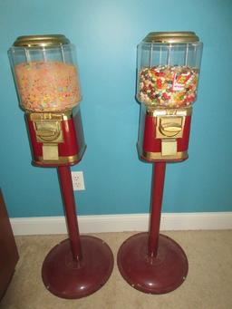 2 Gumball Machine Plastic Globe Sitting on Red Metal Base Stands Operated Mechanically Coin