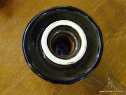 LOT OF 3 INSULATORS; 1 BROWN IN COLOR AND IS MADE BY THOMAS, 1 IS MADE BY HEMINGRAY, AND 1 COBALT IN