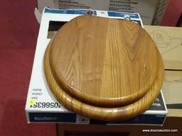 AQUASOURCE TOILET SEAT; OAK WOOD TOILET SEAT. FITS ALL ROUND BOWLS. 16.5 IN. MODEL NO. 0566351. NEW