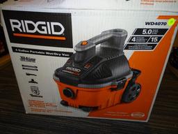 (R6) RIGID 4 GALLON PORTABLE WET/DRY VAC WITH 5HP. MODEL NO. WD4070. COMES IN OPENED BOX.