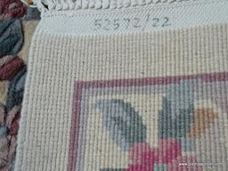 HANDMADE CHINESE SCULPTED AREA RUG IN IVORY, MAUVE AND GREEN. MEASURES APPROXIMATELY 5 FT 7 IN X 9