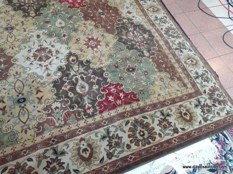 MACHINE MADE ORIENTAL STYLE RUG IN BROWN, IVORY, AND RED. MEASURES APPROXIMATELY 7 FT 8 IN X 10 FT 1