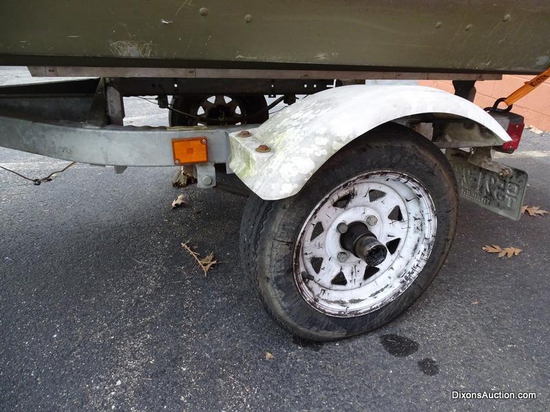 A 2004 Lowe Model L1448M 14 FT. Jon Boat with Venture Single Axel Boat Trailer. Vin #LWCJ0673E404.