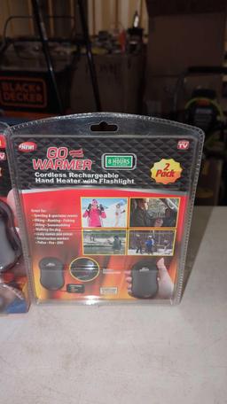 PAIR OF GO WARMER CORDLESS RECHARGEABLE HAND HEATERS WITH FLASHLIGHT STILL IN THE ORIGINAL