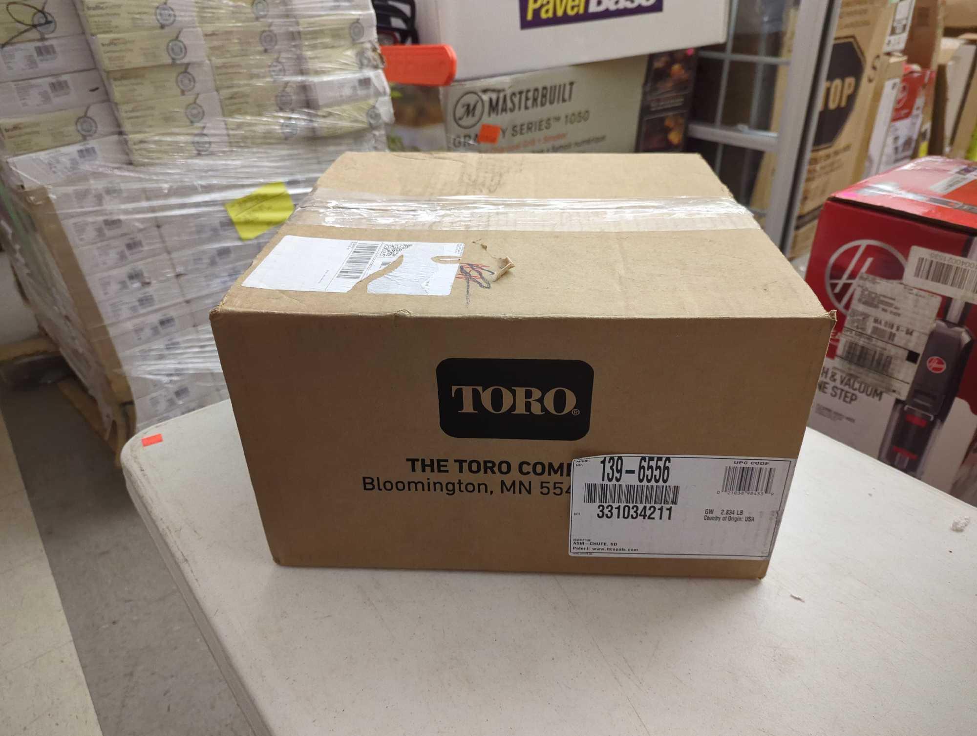 Box Lot including Toro Grass Shooter, Home Decorators Collection 2" and 2.5" Cordless Faux Wood Side