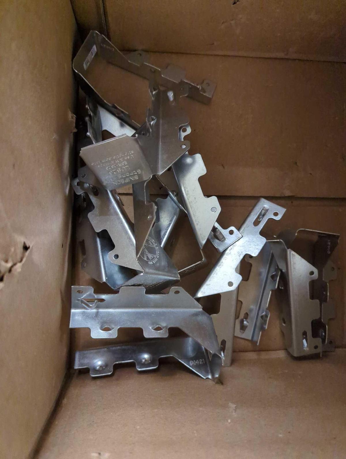 BOX OF SIMPSON STRONG TIE LUS GALVANIZED FACE MOUNT JOIST HANGER FOR 2X6 NOMINAL LUMBER APPEARS TO